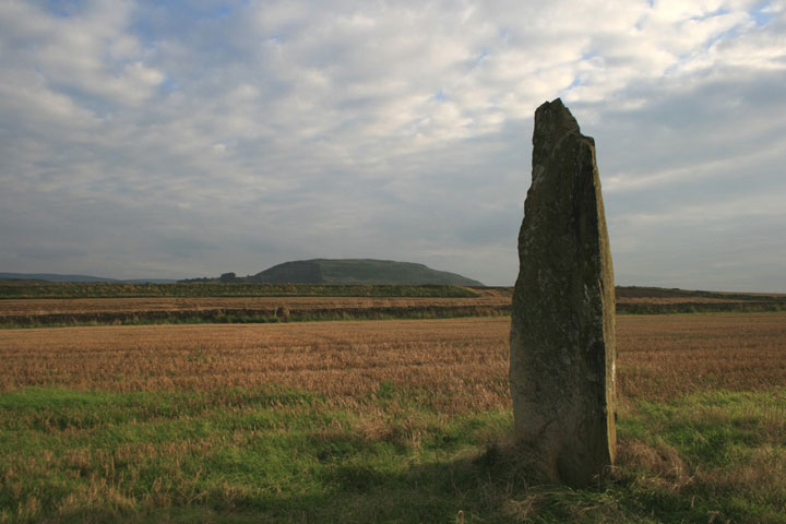 Pencraig Hill standing stone with Traprain Law in the background